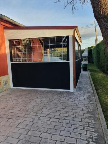 a garage with a black and white garage door at La Mayor del Viso in Toledo