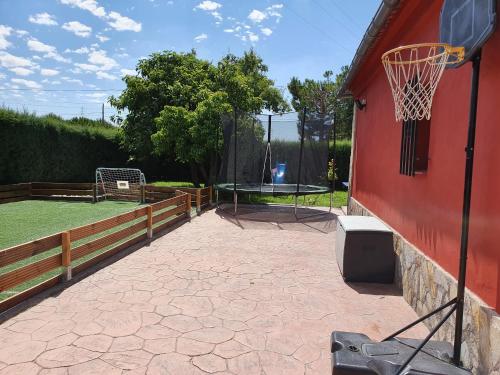 a basketball hoop attached to the side of a building at La Mayor del Viso in Toledo