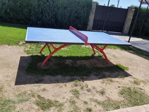 a ping pong table sitting in the grass at La Mayor del Viso in Toledo