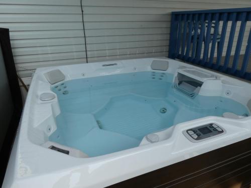 a jacuzzi tub with a thermometer in it at LIV Resort: Clam Circle with Private Jacuzzi (Pet Friendly) in Port Isabel
