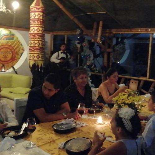 a group of people sitting around a table at ASGARD Spa in San Agustín