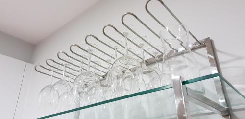 a bunch of clear glasses on a shelf at A Solaina in Lariño