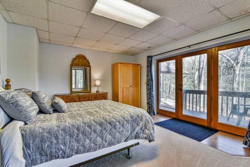 a bedroom with a bed and a large window at The Camby Cabin just 12 miles to downtown Asheville in Asheville