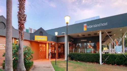 a building with a street light in front of it at Freshly revovated Dog Friendly House walking distance to Waterfront! in Bellara