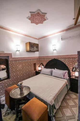 Ένα ή περισσότερα κρεβάτια σε δωμάτιο στο Riad Dar Barae