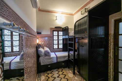 Ένα ή περισσότερα κρεβάτια σε δωμάτιο στο Riad Dar Barae
