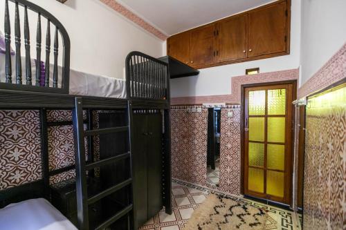 Ένα ή περισσότερα κρεβάτια σε δωμάτιο στο Riad Dar Barae