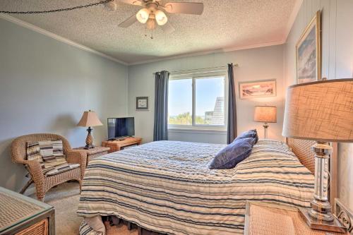 a bedroom with a bed and a window at Isle of Palms Condo with Pool Access Walk to Beach! in Isle of Palms