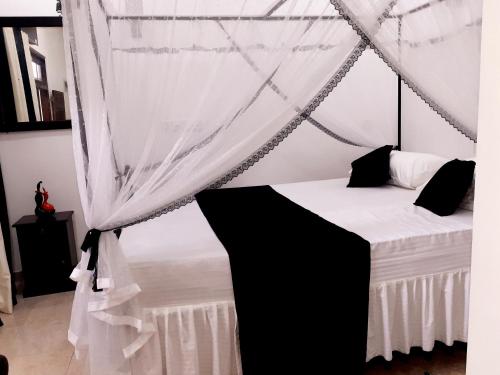 Ένα ή περισσότερα κρεβάτια σε δωμάτιο στο Dihini Villa