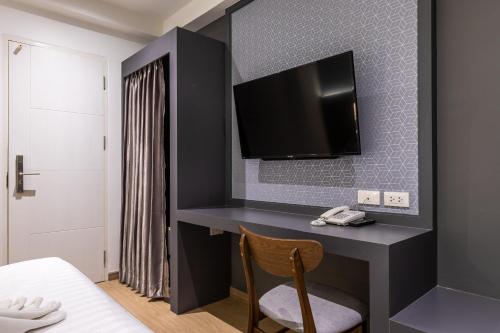 TV a/nebo společenská místnost v ubytování Siam Star Hotel