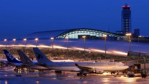 a group of planes parked at an airport at night at Toyoko Inn Osaka Abeno Tennoji in Osaka