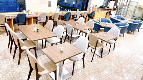 a row of tables and chairs in a restaurant at Toyoko Inn Osaka Umeda Nakatsu No.1 in Osaka