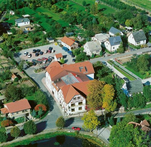 an overhead view of a large house with a roof at Landhotel & Reiterhof Schumann in Triptis