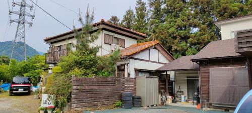 a house with a truck parked in front of it at きっとあい楽館 in Chichibu