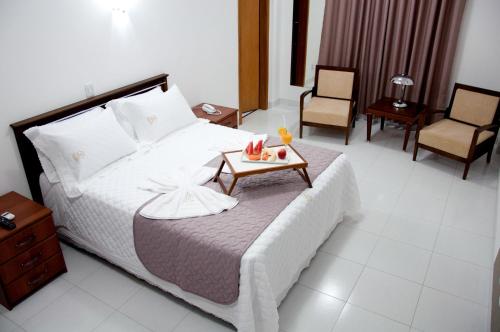 Postel nebo postele na pokoji v ubytování Hotel Roari