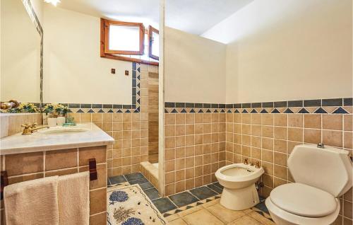 a bathroom with a toilet and a sink at Ilsole in Piano di Mommio