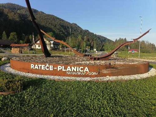 a sign that says raza plande planza in a field at Žbogar in Rateče