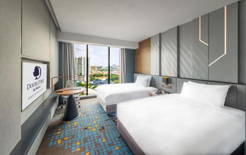 Un ou plusieurs lits dans un hébergement de l'établissement Doubletree By Hilton Shah Alam I-City