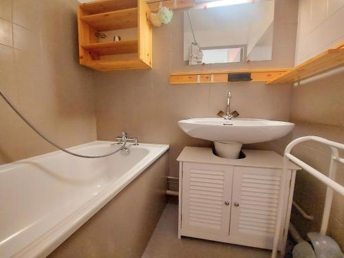 a bathroom with a sink and a toilet and a tub at Cosy appartement au centre de Morillon, proche télécabine, balcon et parking - FR-1-624-104 in Morillon