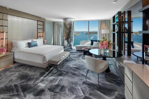 a bedroom with a bed and a living room at Crown Towers Sydney in Sydney