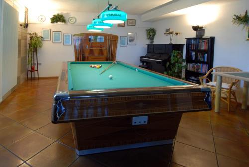 a living room with a pool table in it at Albergo Venezia in Passo Rolle