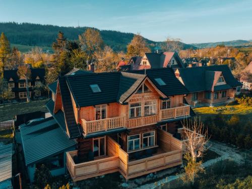 an overhead view of a log home with a roof at Villa Milimani - stuletnia, folk & butique, adults only in Zakopane