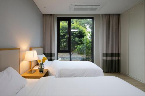 Katil atau katil-katil dalam bilik di Velum Resort
