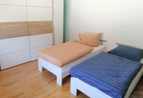 a small room with a bed and a bench at 3 room Apartment in Bürstadt