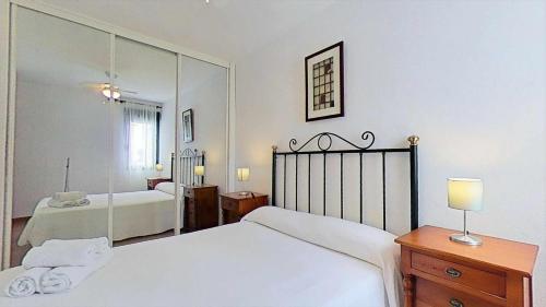 Posteľ alebo postele v izbe v ubytovaní Apartamento en Atlanterra Playa 33A
