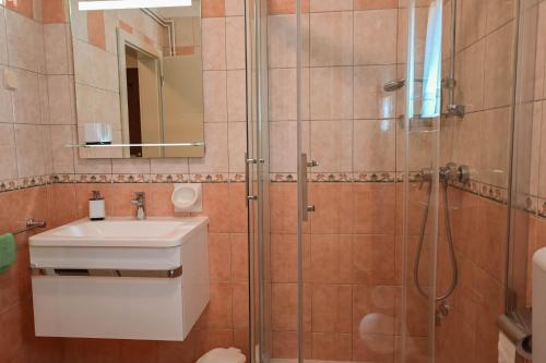 a bathroom with a sink and a shower at Casa Luisa in Poreč