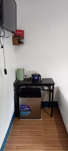 a table with a box under it in a room at Camiguin VIAJEROS House Rental in Compol