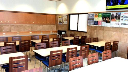 a dining room with tables and chairs at Toyoko Inn Osaka Namba Nishi in Osaka