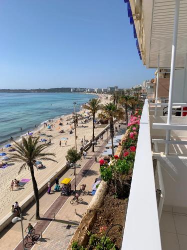 a view of the beach from the balcony of a building at Hotel Voramar in Cala Millor