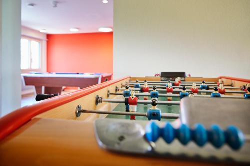 a conference room with billiard tables with balls on them at Reka-Feriendorf Montfaucon in Montfaucon