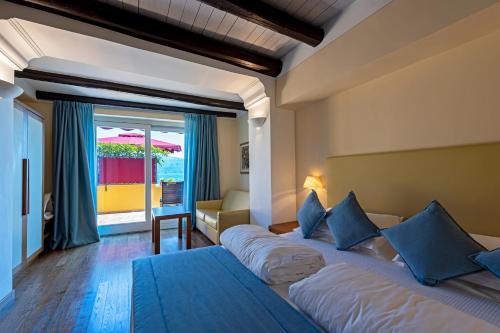 Postel nebo postele na pokoji v ubytování Hotel Baia D'Oro - Adults Only