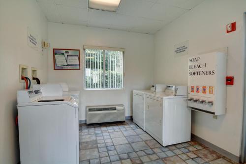 a kitchen with white appliances in a room at Motel 6-Warwick, RI - Providence Airport - I-95 in Warwick