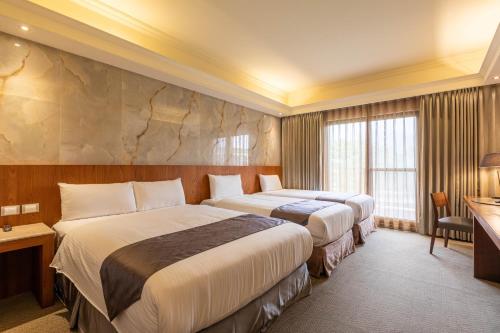 Voodi või voodid majutusasutuse Hualien Toongmao Resort toas