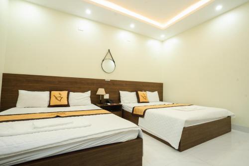 Postel nebo postele na pokoji v ubytování HOẰNG MINH HOTEL