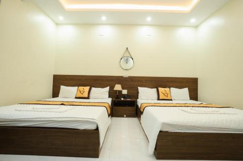 Postel nebo postele na pokoji v ubytování HOẰNG MINH HOTEL