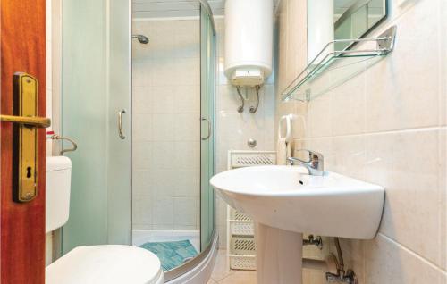 a bathroom with a sink and a toilet at Lovely Apartment In Jadranovo With Kitchen in Jadranovo