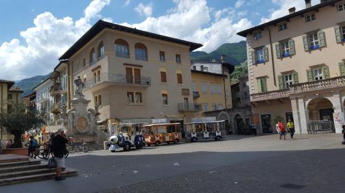 a group of trolley cars on a city street at APPARTAMENTS SUPERIOR ,o SUITE GARDARCO in Arco