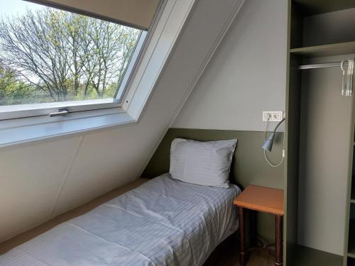 Postel nebo postele na pokoji v ubytování Boszicht 3 appartement in Oostkapelle