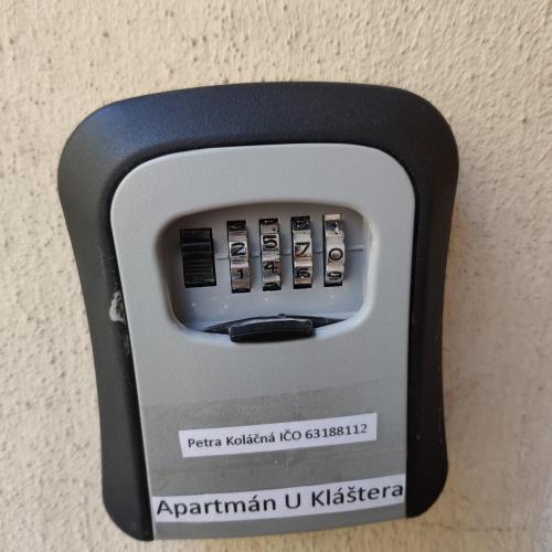 a soap dispenser attached to a wall at Apartmán U Kláštera in Broumov