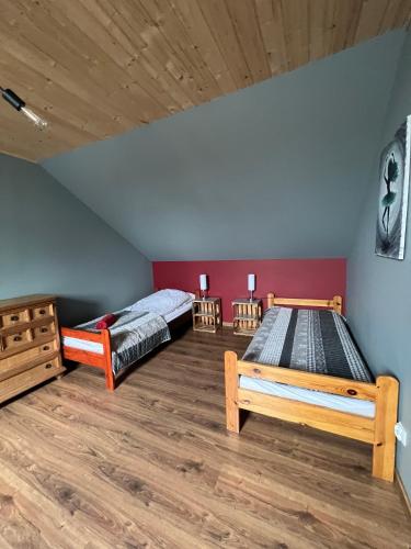 Postel nebo postele na pokoji v ubytování Dom na wynajem Mazury DOM NA WYSOKIM BRZEGU