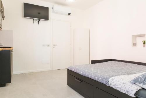 Ένα ή περισσότερα κρεβάτια σε δωμάτιο στο Bed&Biker