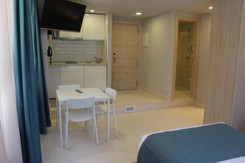 Kuchyň nebo kuchyňský kout v ubytování Modo Hotel Apartamento