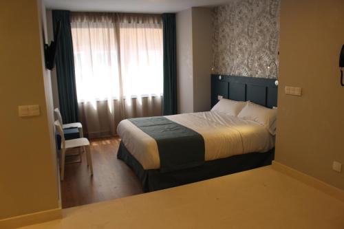 Postel nebo postele na pokoji v ubytování Modo Hotel Apartamento