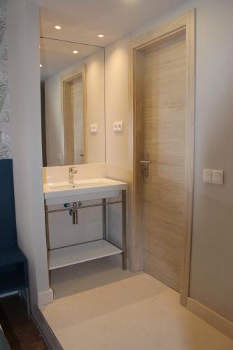 Ett badrum på Modo Hotel Apartamento