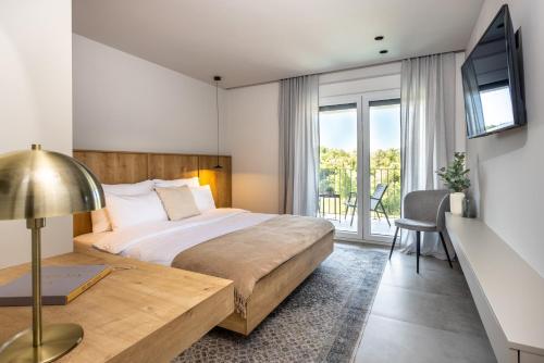 Ένα ή περισσότερα κρεβάτια σε δωμάτιο στο Villa Amari