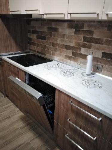 a kitchen with a counter with a stove top at Serafi Cozy Rooms in Archangelos